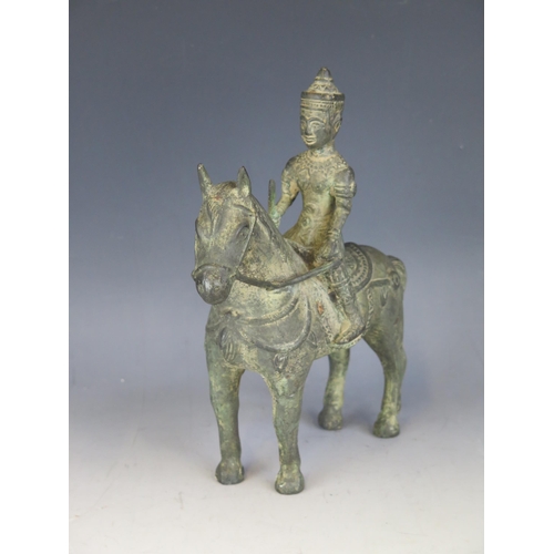 1436 - An Indian bronze figure of Khandoba, mounted on a horse, 23cmm long.