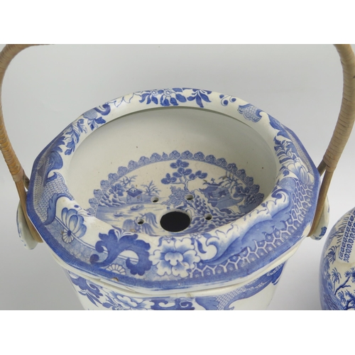 1444 - A Masons blue and white slop pail, with willow pattern style decoration, with cane loop carrying han... 