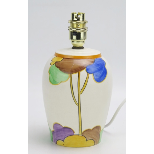 1459 - A Clarice Cliff style hand painted pottery table lamp, 22cm high.