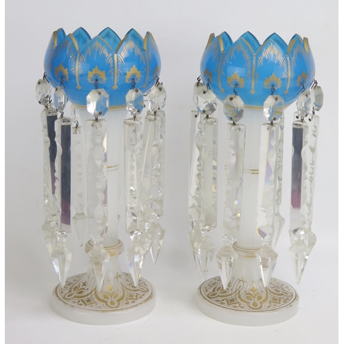 1484 - A pair of clear and blue glass Victorian lusters, with facetted prismatic drops, with gilded decorat... 