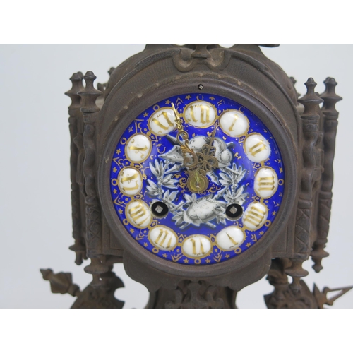 1493 - A 19th century metal and enamel mantel clock, with 8.5cm Roman dial, the case with applied military ... 