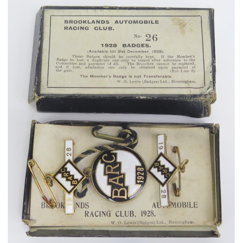 1539A - A boxed set of three BARC Brooklands member's and guest's lapel badges, 1928,
number 26, in white, a... 