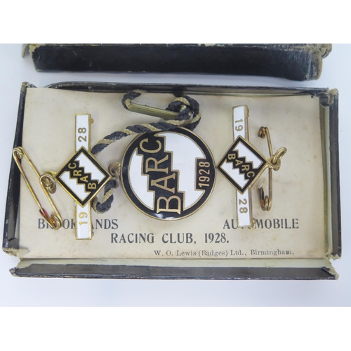 1539A - A boxed set of three BARC Brooklands member's and guest's lapel badges, 1928,
number 26, in white, a... 