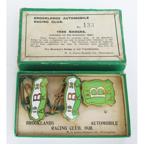 1539B - A boxed set of three BARC Brooklands member's and guest's lapel badges, 1930,
number 133, in white, ... 