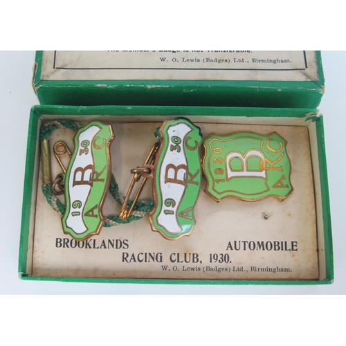 1539B - A boxed set of three BARC Brooklands member's and guest's lapel badges, 1930,
number 133, in white, ... 