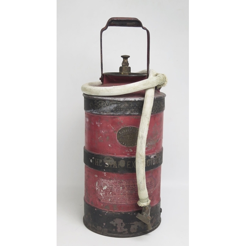 1548 - The 'Star' fire extinguisher,  of cylindrical form with rubber and canvas bound hose, 52cm high.