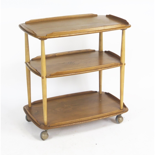 1646 - An Ercol Elm Three Tier Tea Trolley