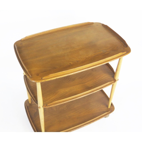 1646 - An Ercol Elm Three Tier Tea Trolley