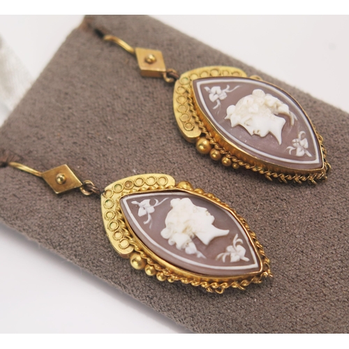 167 - A Pair of Victorian Shell cameo Pendant Earrings in a high carat precious yellow metal setting and d... 