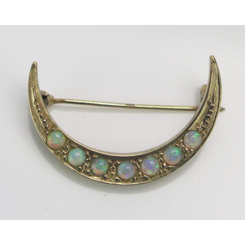 169 - A 9ct Gold and Opal Crescent Brooch, 29.55mm, CCM mark, 4g