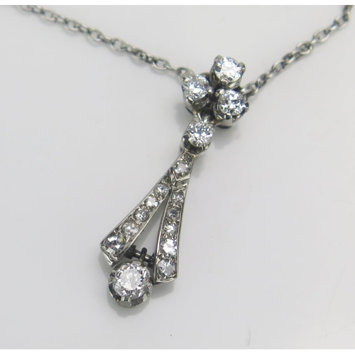 173 - A Diamond Pendant in a precious white metal setting (tests as platinum, 22.8mm drop) and on a 9ct wh... 