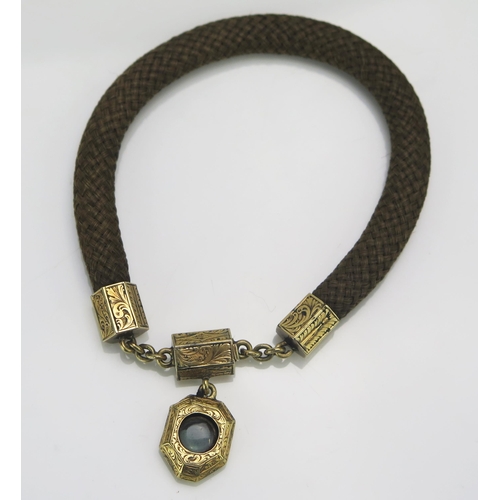 191 - A Victorian Hair Memorial Bracelet with platted hair locket to the precious yellow metal clasp, 20.5... 