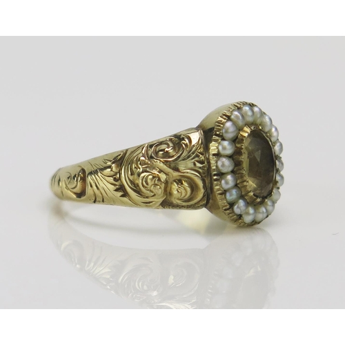 193 - A Georgian Split Pearl and Foil Backed Gem Set Ring in a high carat precious yellow metal setting wi... 