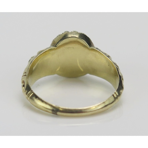 193 - A Georgian Split Pearl and Foil Backed Gem Set Ring in a high carat precious yellow metal setting wi... 