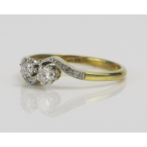 196 - An 18ct Gold and Brilliant Cut Diamond platinum Set Crossover Ring, c. 3.5-3.35mm stones, size M.5, ... 