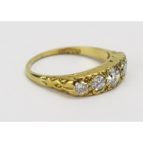 24 - An 18ct Gold and Diamond Five Stone Ring, c. 4.73mm principal round cut, size N.75, 4.06g. Shank ver... 