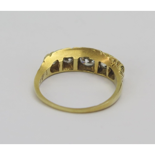 24 - An 18ct Gold and Diamond Five Stone Ring, c. 4.73mm principal round cut, size N.75, 4.06g. Shank ver... 