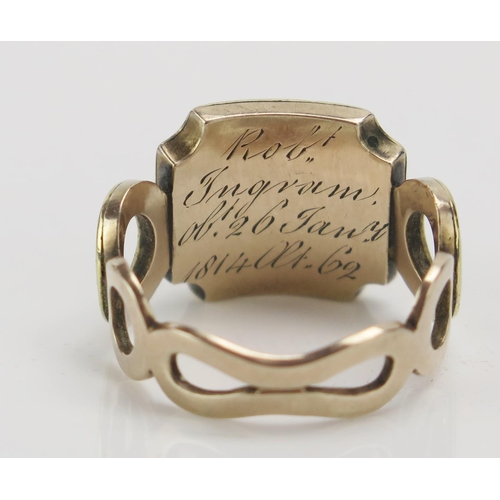 249 - A Georgian Memorial Ring with a central panel of platted hair with a border of split pearls, further... 