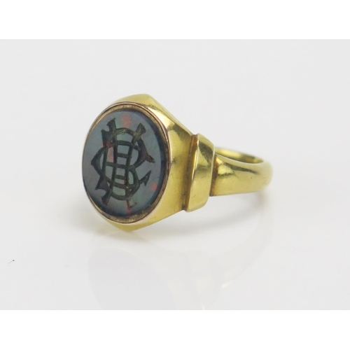 256 - A Victorian 18ct Gold and Bloodstone Signet Ring engraved with a monogram, size O.5, Chester 1881, S... 