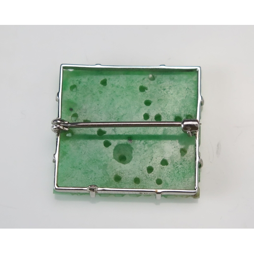 294 - A 9ct White Gold and Carved Jade Panel Brooch with pierced foliate decoration, 26.9x24.6mm, stamped ... 