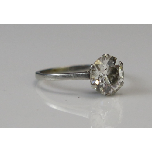 323 - A Natural Brilliant Round Cut Diamond Solitaire Ring in a precious white metal setting, size M.75, 8... 