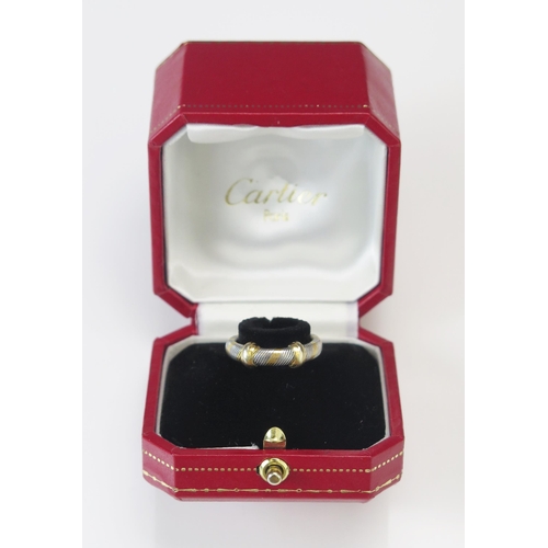 324 - A Cartier 18K Gold and White Metal Ring, engraved Cartier and size 52 56281, size L.25, 5.43g, Carti... 