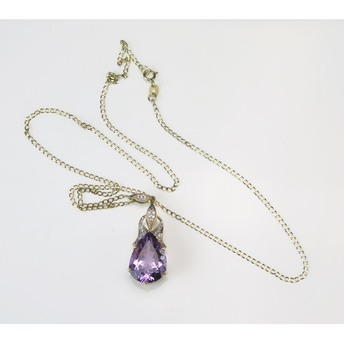 329 - A 9ct Gold, Amethyst and Diamond Pendant, 39.4mm drop, and on a 9ct gold chain, 51cm, 5.96g