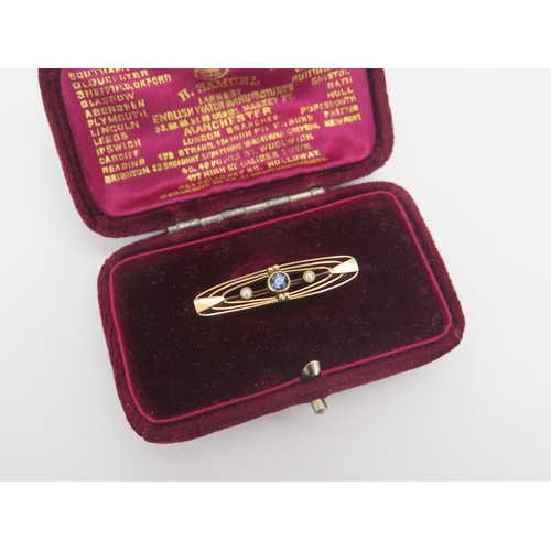 36 - An Antique 9ct Gold, Sapphire and Seed Pearl Brooch, 33.07mm, stamped 9CT, 1.96g. H. Samuel box