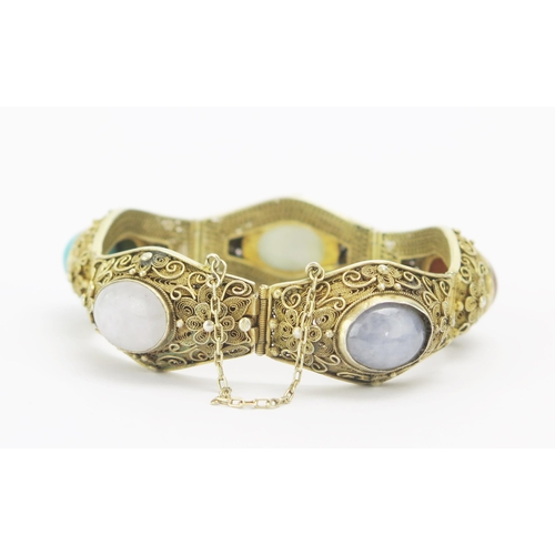 39 - A Chinese Silver Gilt Filigree Bracelet set with agate and turquoise specimens, 21mm wide panels, st... 