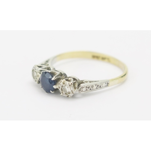 43 - An 18ct Gold, Sapphire and Diamond Three Stone Ring in a platinum setting, c. 4.88mm principal stone... 