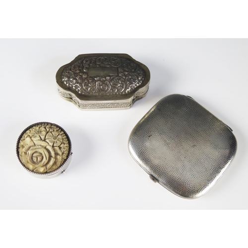 531 - A white metal box of cartouche-shaped outline, 9cm long, a silver plated and lava mounted circular b... 