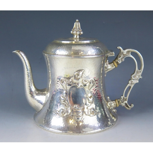 539 - A Victorian beaten silver teapot, maker Johnson, Walker & Tolhurst Ltd, London 1900, of bell-shaped ... 