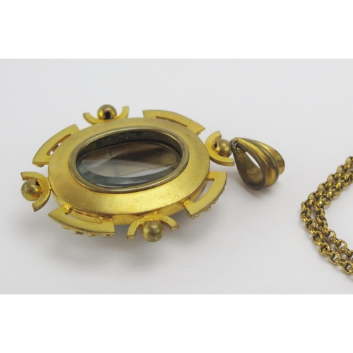 54 - A Victorian Banded Agate Locket Back Gilt Metal Pendant (71.3mm drop) and with a gilt metal chain