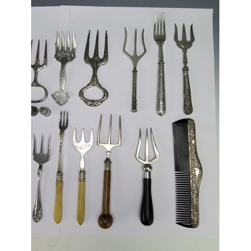 549 - A cpo0llection of silver plated flatwares including pickle forks, ham forks, silver mounted comb, et... 