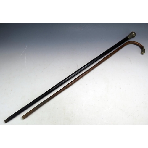 590 - An ebonised and silver mounted walking stick, together with a malacca and silver mounted walking sti... 