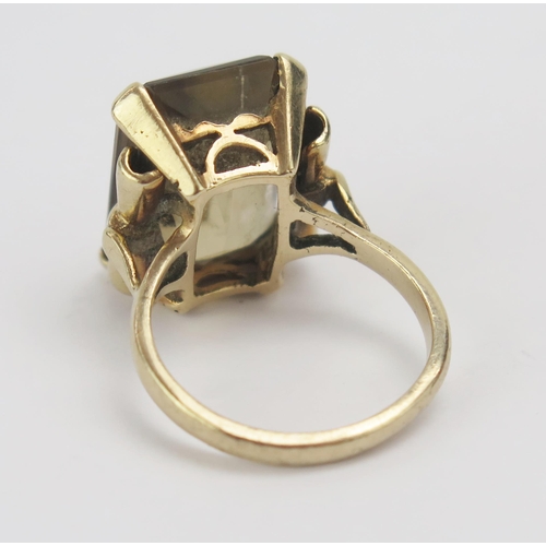 60 - A 9ct Gold and Citrine Dress Ring, c. 18x13mm stone, size N.5, stamped 9CT, 8.14g