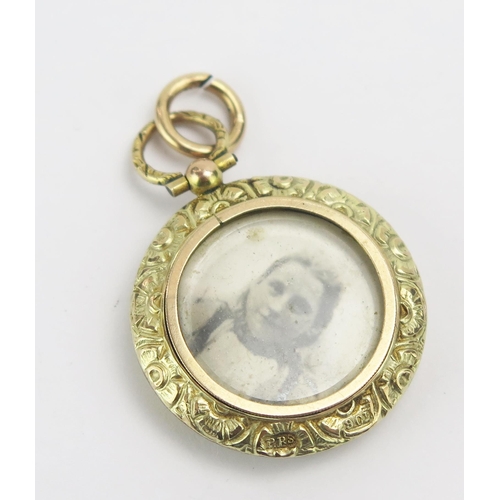 63 - An Antique 9ct Gold Double Sided Locket, 37.1mm drop without second suspension loop, stamped 9CT, 6.... 