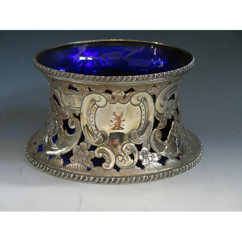 632 - A silver plated dish ring  with pierced decoration of figures, birds scrolls and flowers, having a b... 