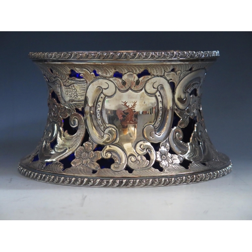 632 - A silver plated dish ring  with pierced decoration of figures, birds scrolls and flowers, having a b... 