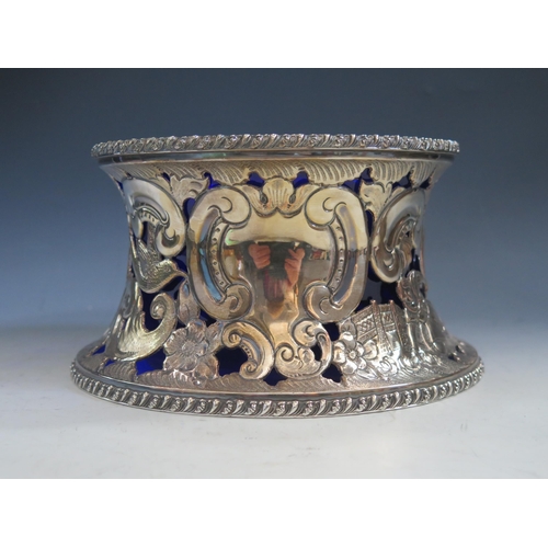 632 - A silver plated dish ring  with pierced decoration of figures, birds scrolls and flowers, having a b... 