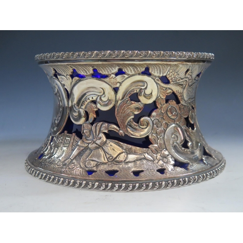 632 - A silver plated dish ring  with pierced decoration of figures, birds scrolls and flowers, having a b... 