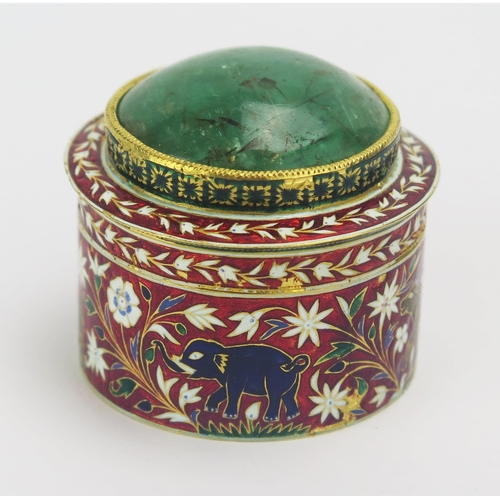 634 - An Indian gold and champlevé enamel circular box and cover, the lift off lid with inset domed emeral... 