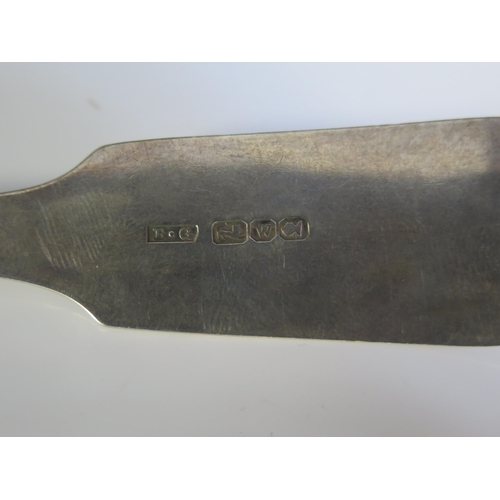 637 - An early 19th century silver Fiddle pattern table spoon, possibly Canadian, maker B.G, monogrammed, ... 