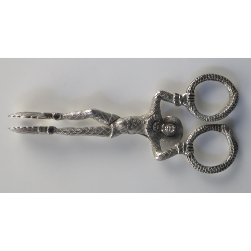 664 - A Pair of Victorian silver sugar-nips, maker Joseph Willmore, Birmingham, 1841 modelled as a harlequ... 