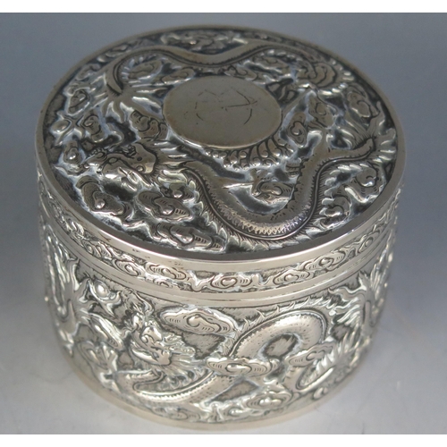 666 - A Chinese export silver circular jar and cover , maker Kwan Wo, Hong Kong, the shallow domed lift-of... 