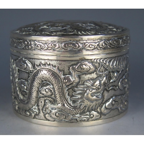 666 - A Chinese export silver circular jar and cover , maker Kwan Wo, Hong Kong, the shallow domed lift-of... 