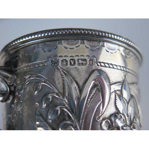 674 - A Victorian silver christening cup, maker Martin, Hall & Co, Sheffield, 1866, initialled, with embos... 