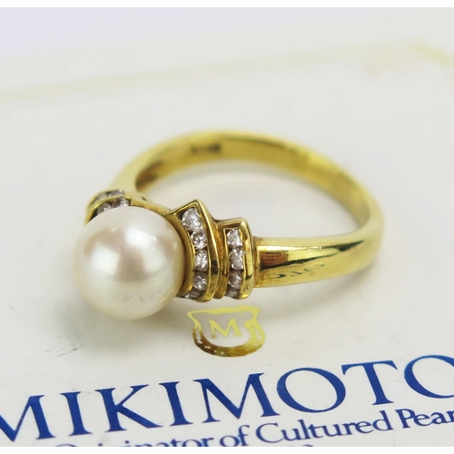 68 - An 18CT Gold, Cultured Pearl and Diamond Ring with a Mikimoto certificate, size N.5, stamped 18ct, 5... 