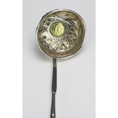 685 - A Georgian silver toddy ladle, unmarked, the circular bowl inset with George II coin  dated 1758, mo... 