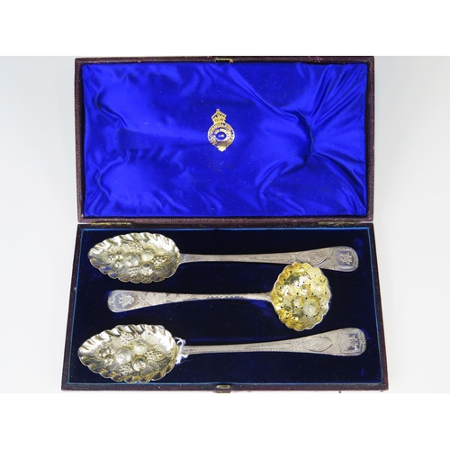 700 - Two George III silver and later decorated berry spoons together with a George III sifting spoon, cas... 